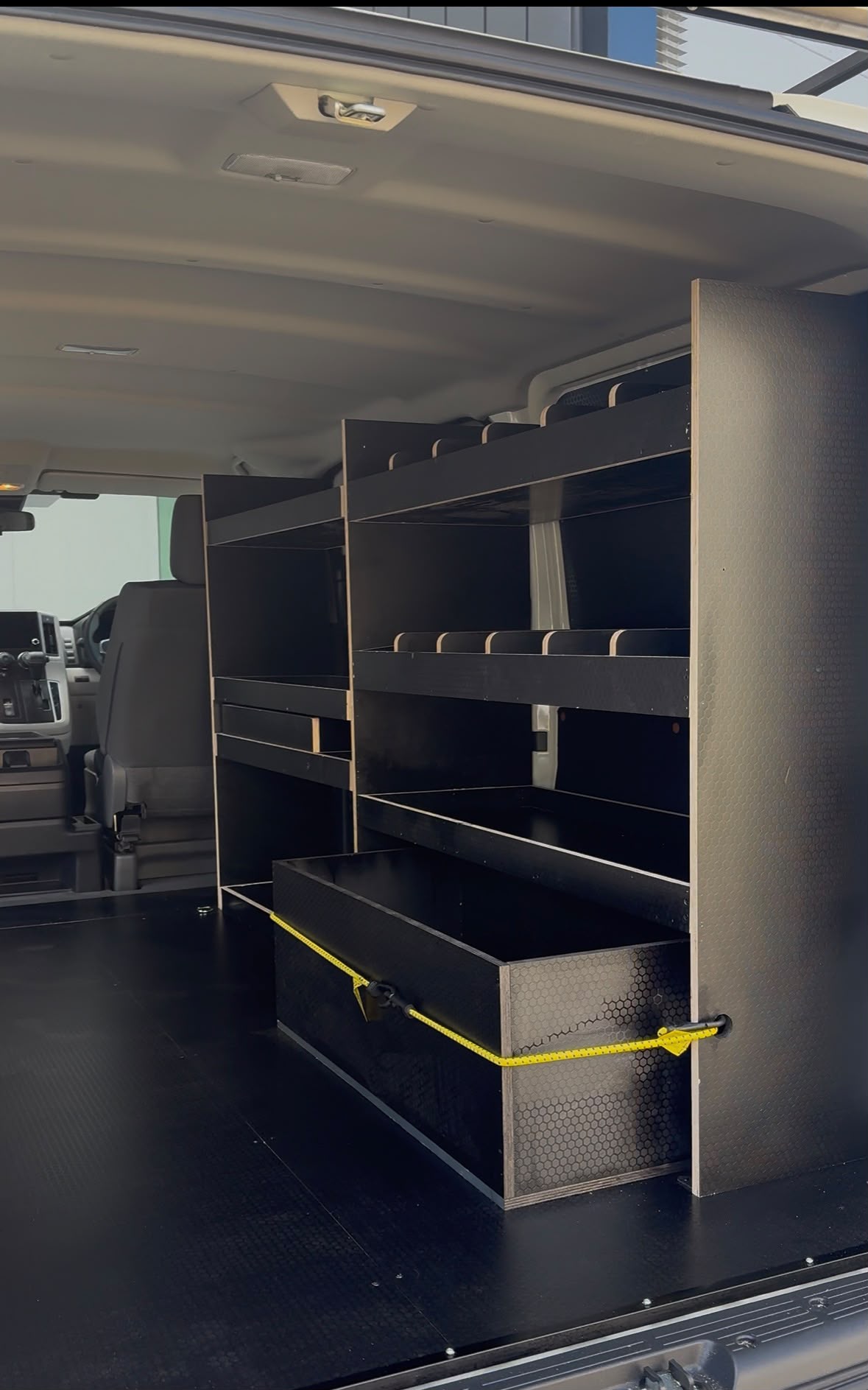 Single-side shelving system for a tradie van